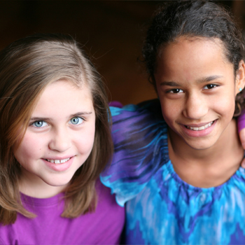 two young girls smiling